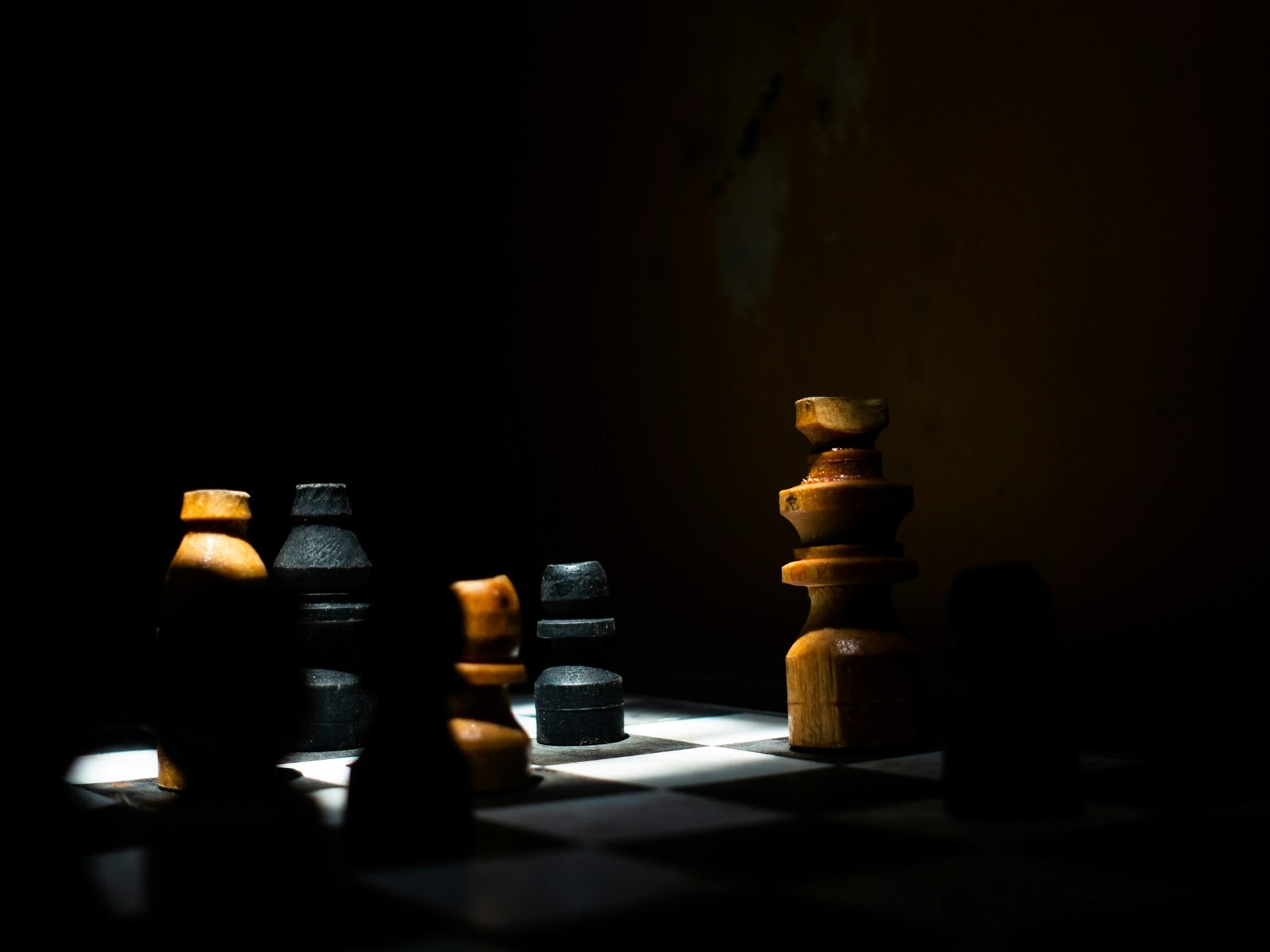 a group of chess pieces sitting on top of a chess board